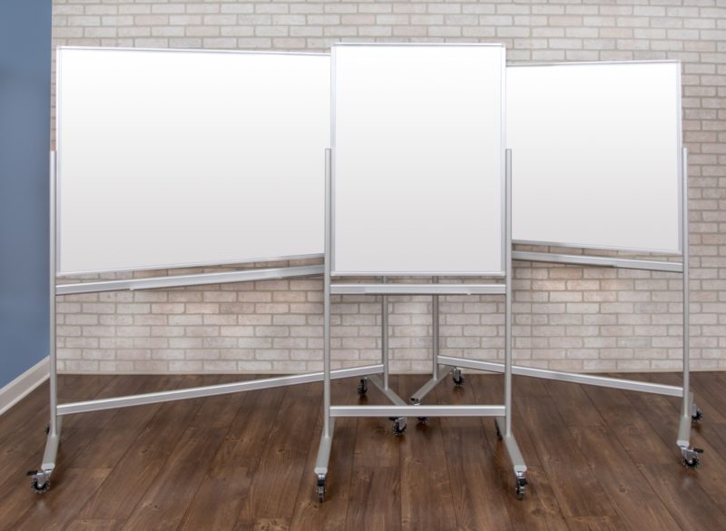 Three Mobile Glass Dry Erase Boards standing together